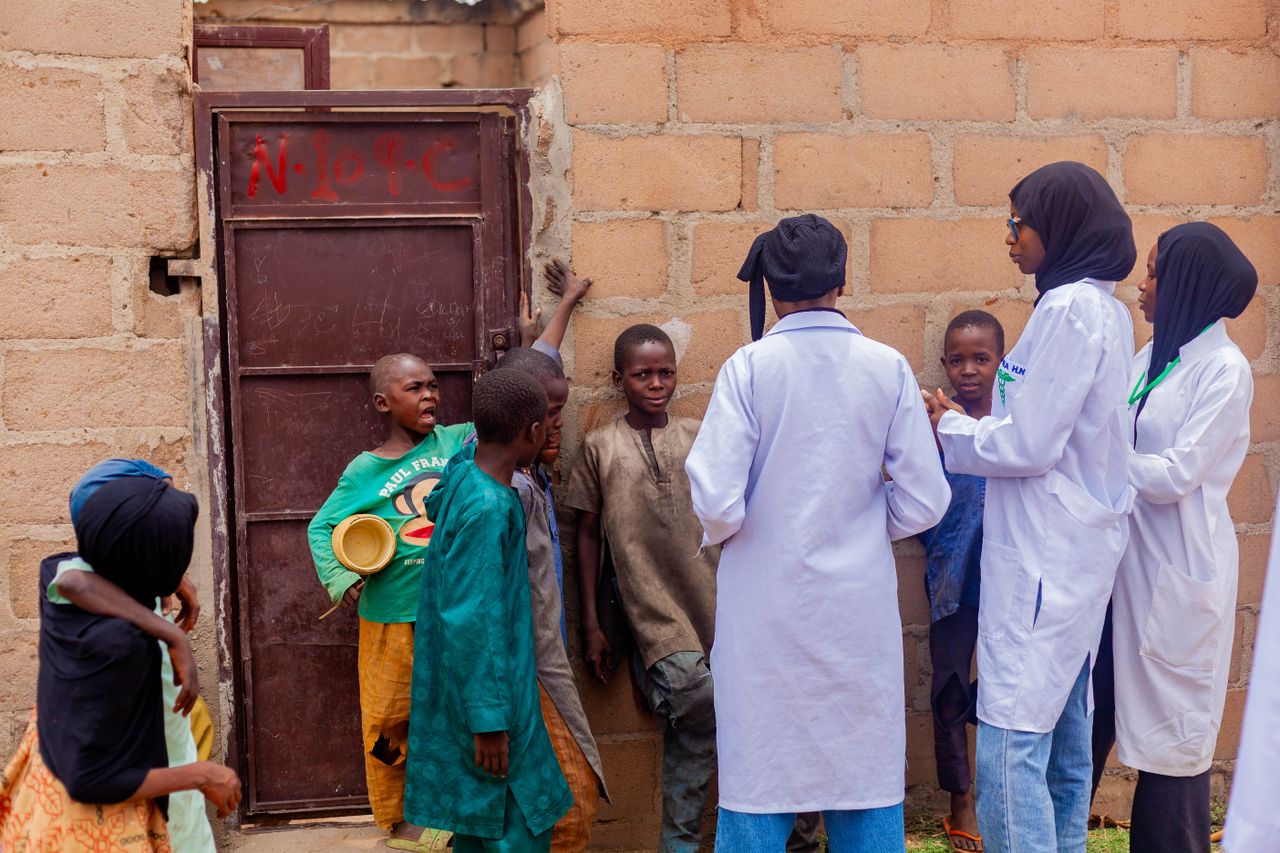 services-03 Healthcare workers engage with children in Gombe, Nigeria, promoting community health awareness.