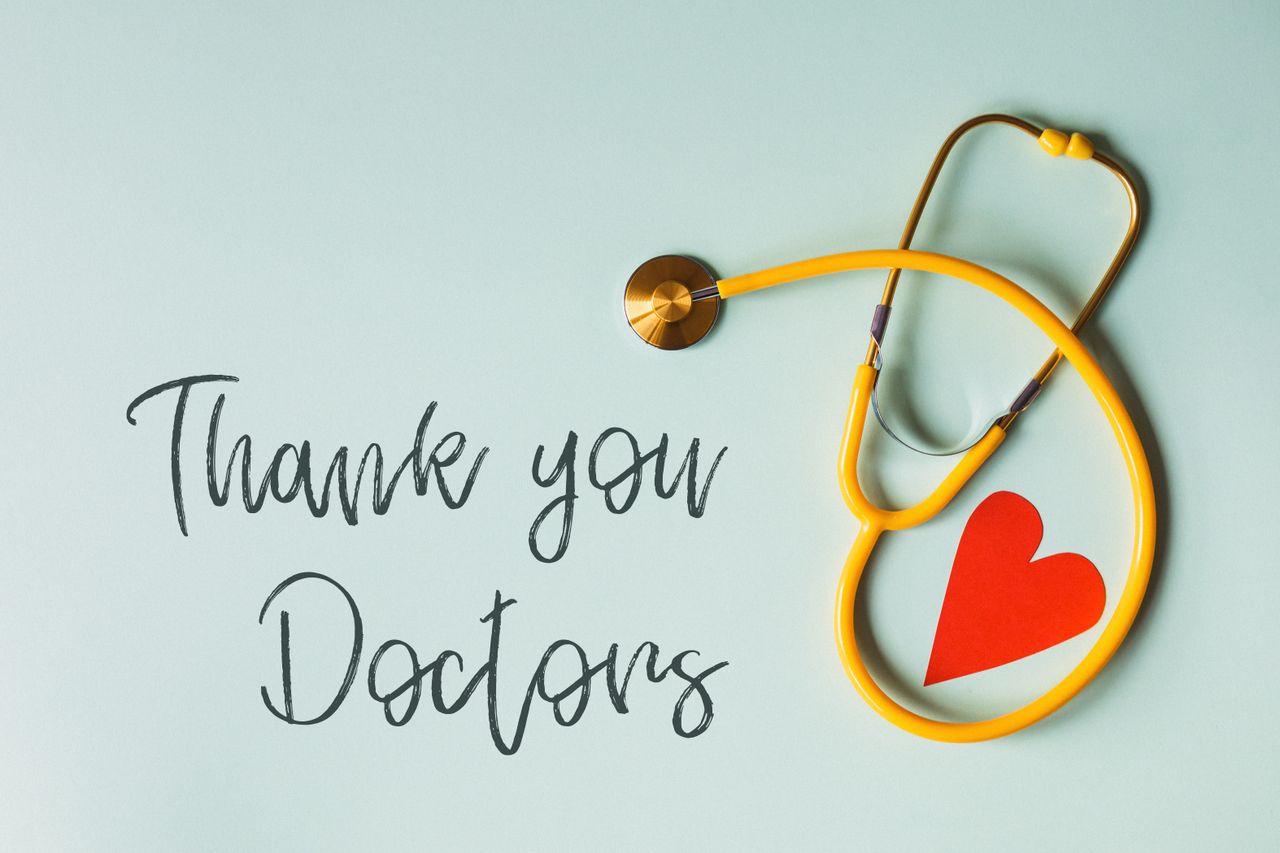 why-choose-us From above arrangement of yellow stethoscope with red heart shape placed on blue background with THANK YOU DOCTORS inscription